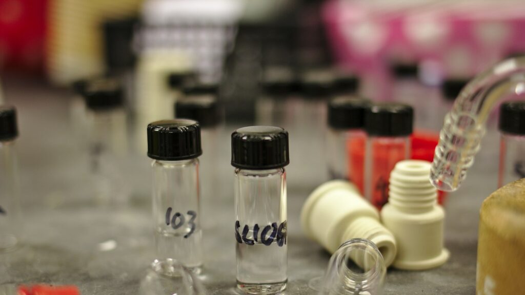 A group of clear glass vials