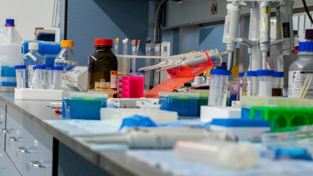 Laboratory bench covered with research tools and equipment