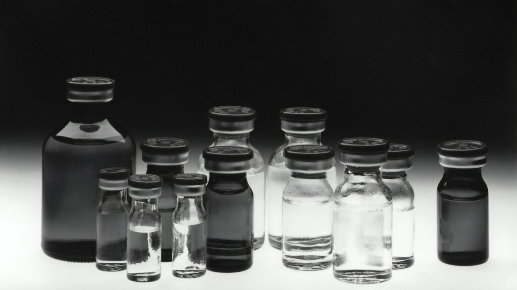 Black-and-white photo of glass laboratory tubes