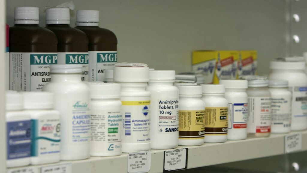 What Is a DIN Number? Drug Identification Numbers in Canada Explained 1 Pharmacy shelf stocked with boxes of medicine