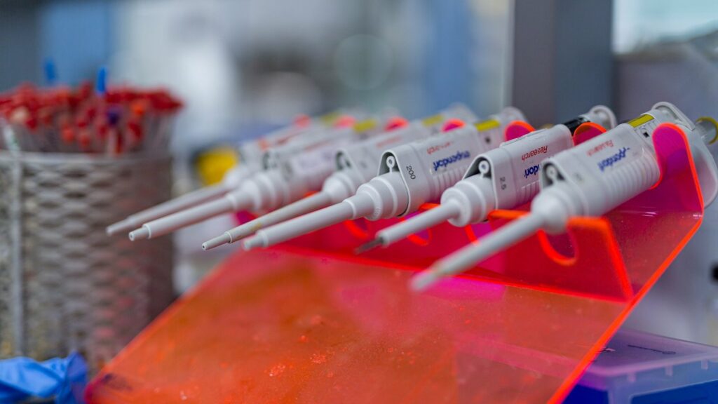 Laboratory pipettes lined up ready for research