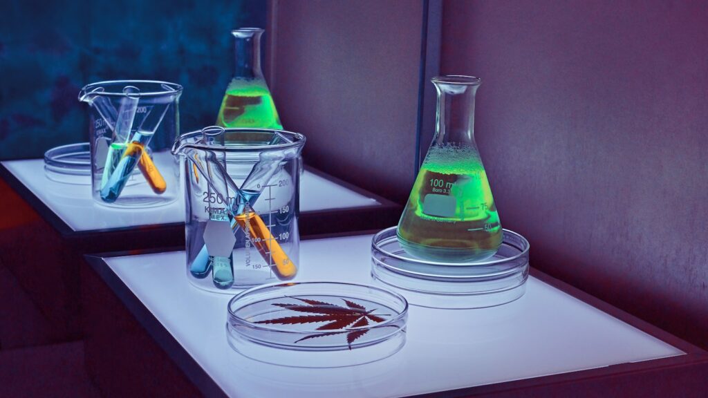Clear glass laboratory bottles on a white table