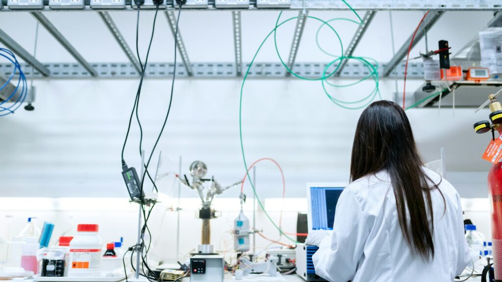 GLP-1 Peptides Explained: A Research Map from Semaglutide to Retatrutide 1 Scientist in a white lab coat using a laptop in a laboratory
