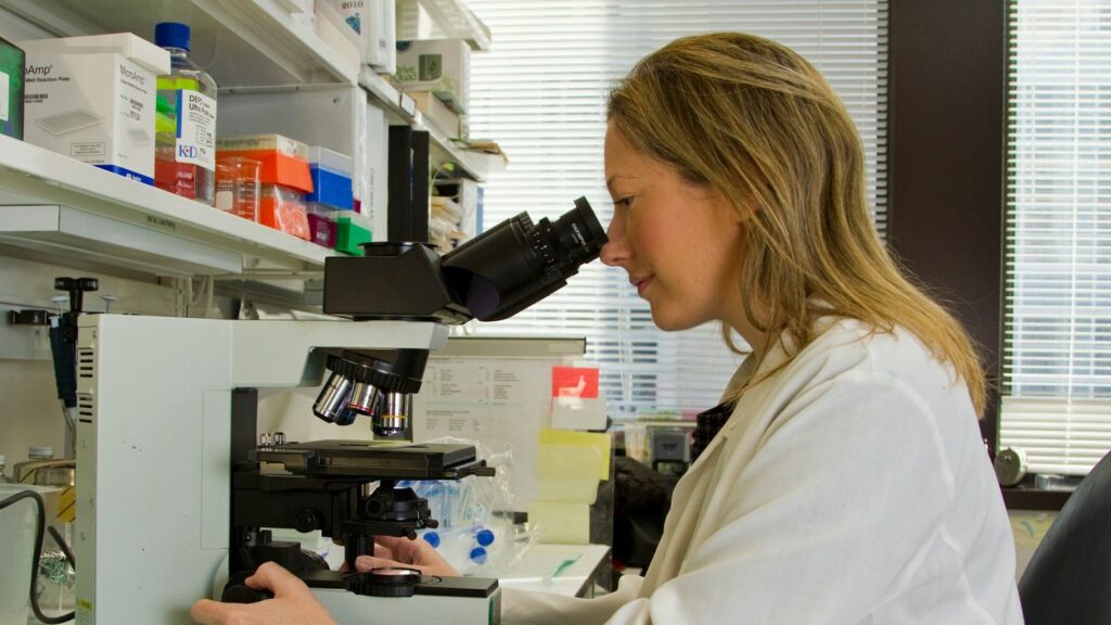 How to Spot Fake or Underdosed Research Peptides 1 Scientist examining a sample through a microscope