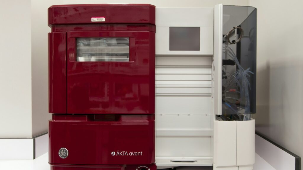 LC-MS Explained: How a Peptide's Identity Is Confirmed 1 A chromatography instrument coupled to a mass spectrometer on a laboratory bench