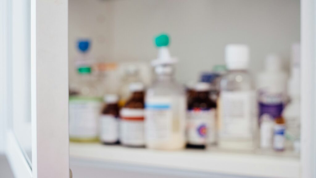 White bottles with red labels standing together