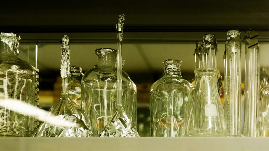 Laboratory glassware displayed on a shelf
