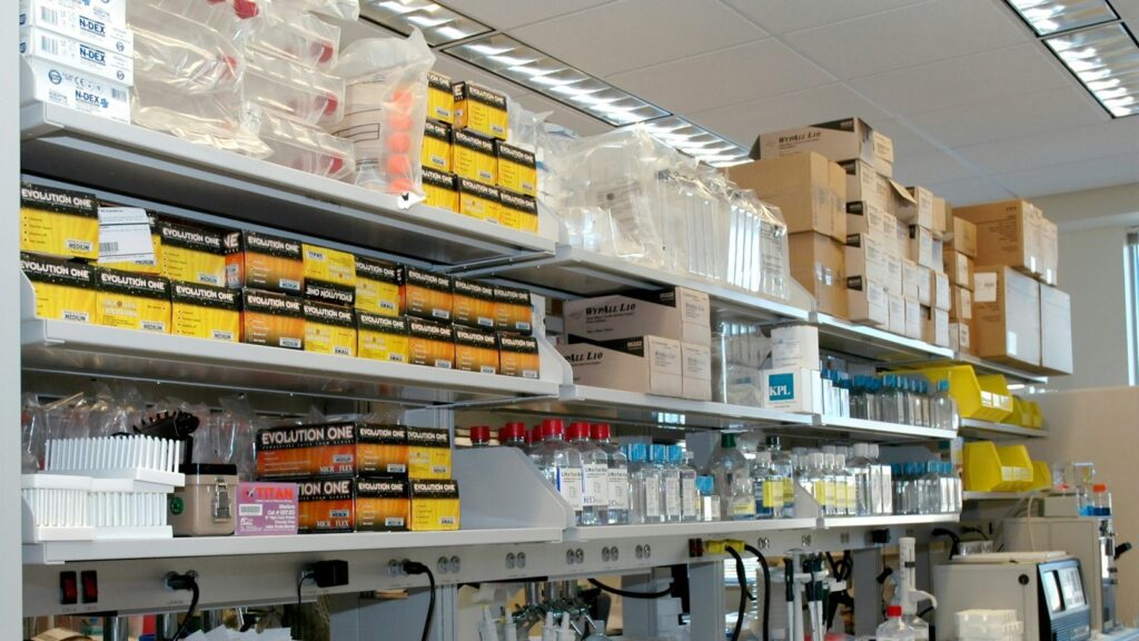 Research Peptide Prices in Canada: What You're Paying For 1 Laboratory shelf holding bottles and boxes of supplies
