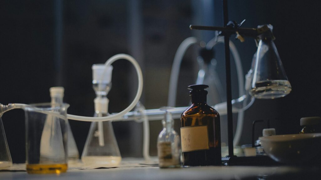 Somatostatin: The Brake on Growth Hormone 1 Assorted empty laboratory glassware standing on a dark bench lit from below