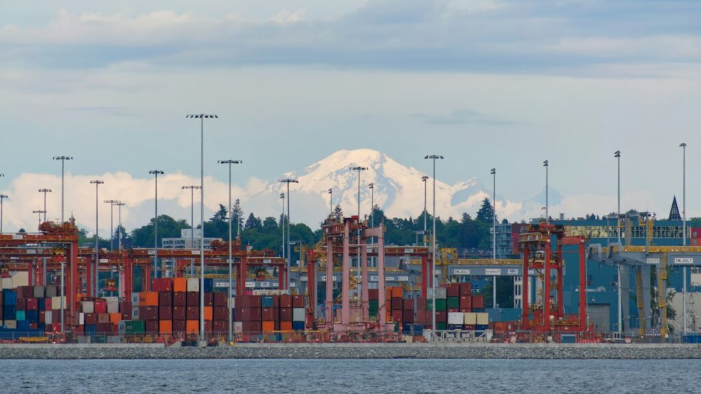 View of Mount Baker behind the port of Vancouver, across a large body of water